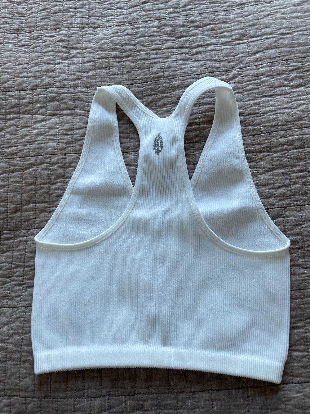 FP Movement by Free People White Ribbed Racerback Tank stretching - Picture 3 of 5